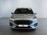 the front view of a silver ford monde parked in a showroom