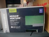 a cardboard box with a green and black design on it