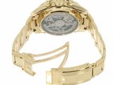 a close up of a watch on a gold bracelet on a white background