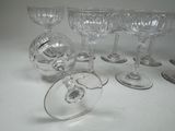 six wine glasses sitting on a table next to each other