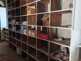 a room that has a lot of shelves in it