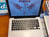 a laptop that is sitting on a desk with a keyboard