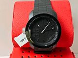 black watch on a red box with a price tag on it