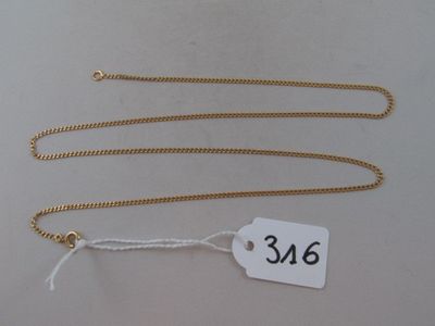 a close up of a tag on a chain on a table