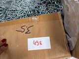 a box with a lot of screws and bolts in it
