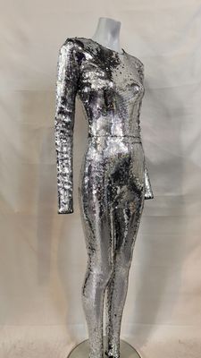 the mannequin is made of shiny silver sequins