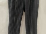 a black and white striped pants hanging on a hanger