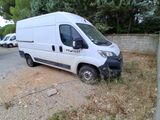 a white van that is parked on the side of the road