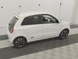a picture of a small white car parked in a garage