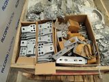 a box full of assorted metal parts on a pallet