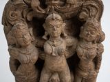 a statue of a group of people on a pedestal