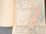 a map of the city of paris on a book