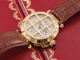 a close up of a watch on a red book