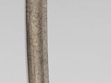 a silver and gold object with a spiral design on it