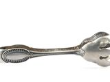 a spoon and a spoon rest on a white surface