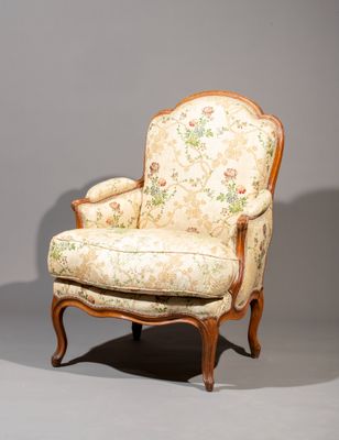 chair with floral upholstered upholstered back and foot rest