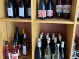 many bottles of wine on the shelves in the room