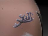 a close up of a motorcycle helmet with the word hell written on it