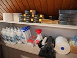 a shelf full of cleaning supplies and supplies on the wall