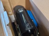 a box with a vacuum in it and a box with a phone inside of it