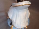 a figurine of a penguin sitting on top of a table
