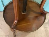 a small table with a clock on top of it