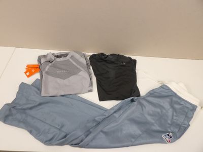 a pile of clothing that is on a white table