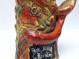 a ceramic mug that has a picture of a fox on it