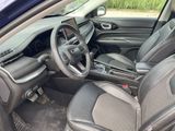 the interior of a car with a steering wheel and a dash board