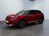 un SUV Toyota C-HR rouge garé dans un showroom