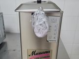 a bag of ice sitting on top of a machine