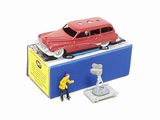 a red toy car sitting on top of a blue box