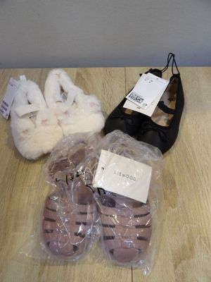 several pairs of shoes that are sitting on a table