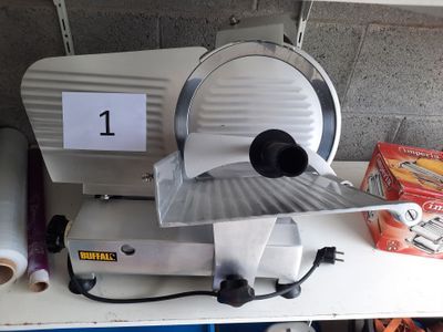a picture of a slicer sitting on top of a table