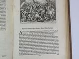 an open book with a picture of a man on horseback in the middle of it