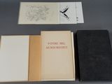 three books sitting on top of a table next to each other