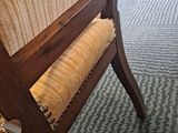 a chair that is sitting on the carpet in the room