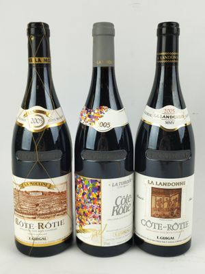 three bottles of wine sitting next to each other on a table