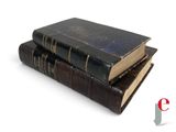 three books stacked on top of each other on a white surface