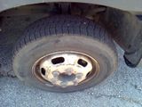 a flat tire on the side of a truck