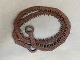 an old rusty piece of metal with a hole in the middle