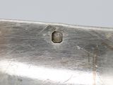 a silver plate with a hole in the middle of it