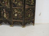 a black and gold oriental screen with birds and flowers on it