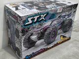 a close up of a box with a toy truck inside of it