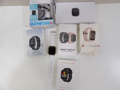 a white refrigerator with a bunch of electronic items on it
