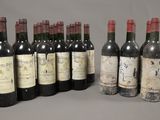 several bottles of wine are lined up in a row