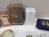 many different types of perfumes on display on a table
