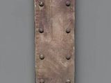 a wooden ruler that is hanging on the wall