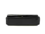 a black leather bag with a gold clasp on the front