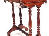 an old wooden table with a drawer on top of it
